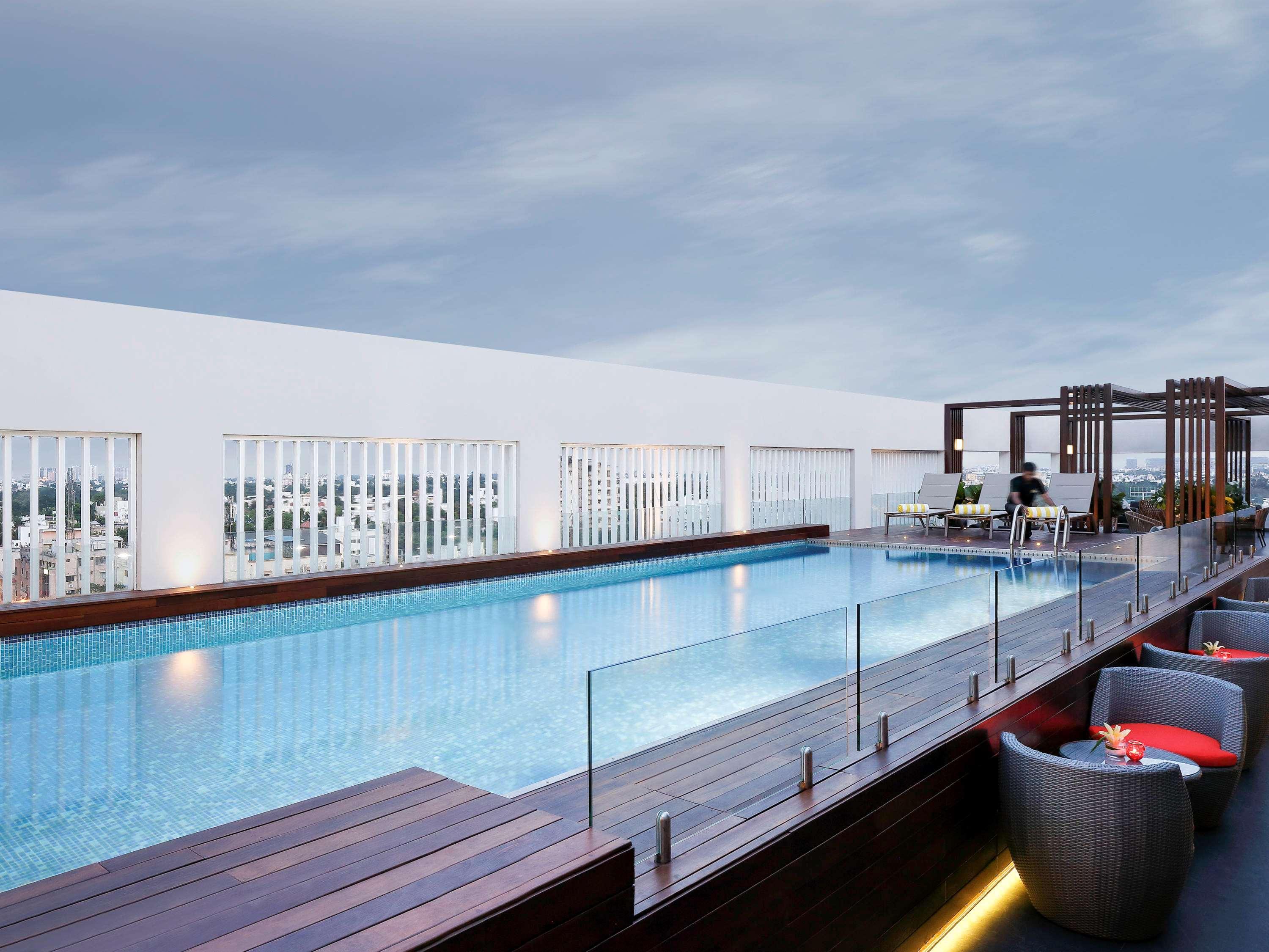 Novotel Chennai Chamiers Road Exterior photo The swimming pool at the hotel
