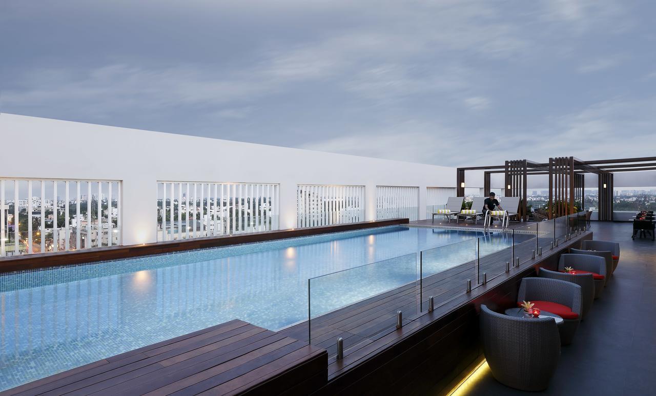 Novotel Chennai Chamiers Road Exterior photo The swimming pool at the hotel